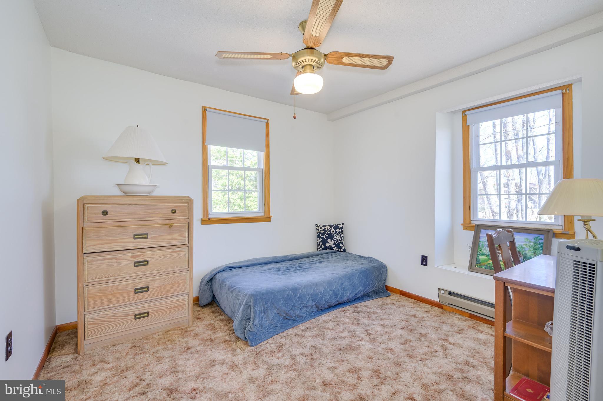 1524 Lamplight Road Bunker Hill, WV 25413 - Photo 20 of 44 a bedroom with a bed and a dresser