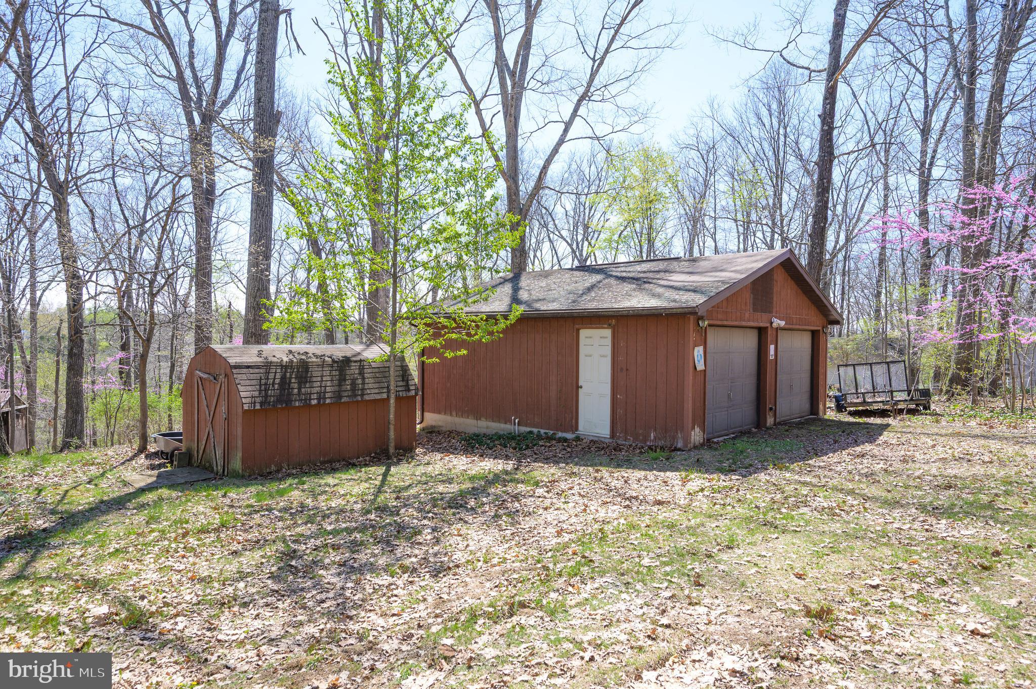 1524 Lamplight Road Bunker Hill, WV 25413 - Photo 26 of 44 a view of a house with a yard and tree