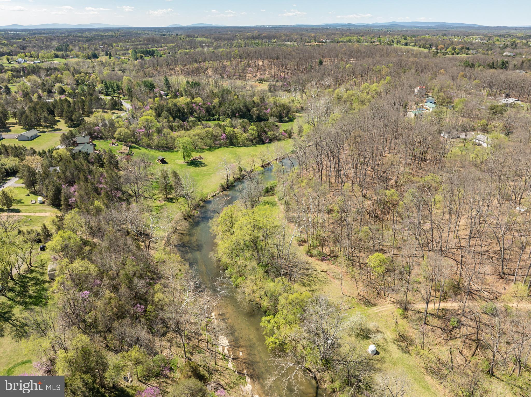 1524 Lamplight Road Bunker Hill, WV 25413 - Photo 36 of 44 an aerial view of residential houses with outdoor space