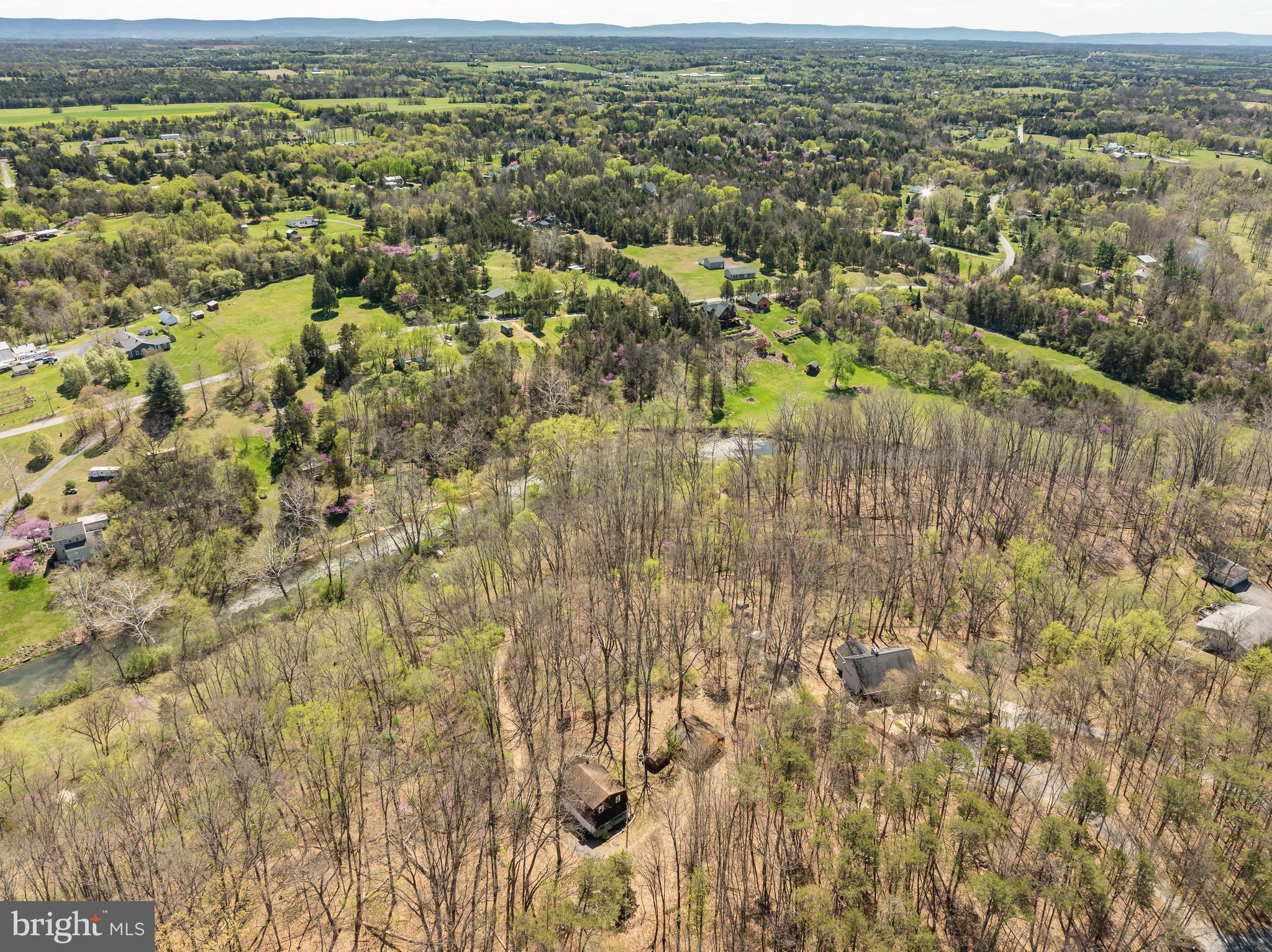 1524 Lamplight Road Bunker Hill, WV 25413 - Photo 37 of 44 an aerial view of residential houses with outdoor space