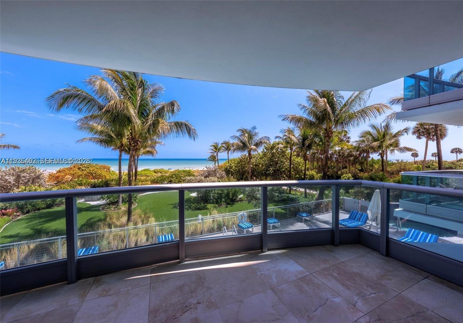 9401 Collins Avenue, Unit 206 Surfside, FL 33154 - Photo 7 of 21 a view of a chairs and table in the balcony