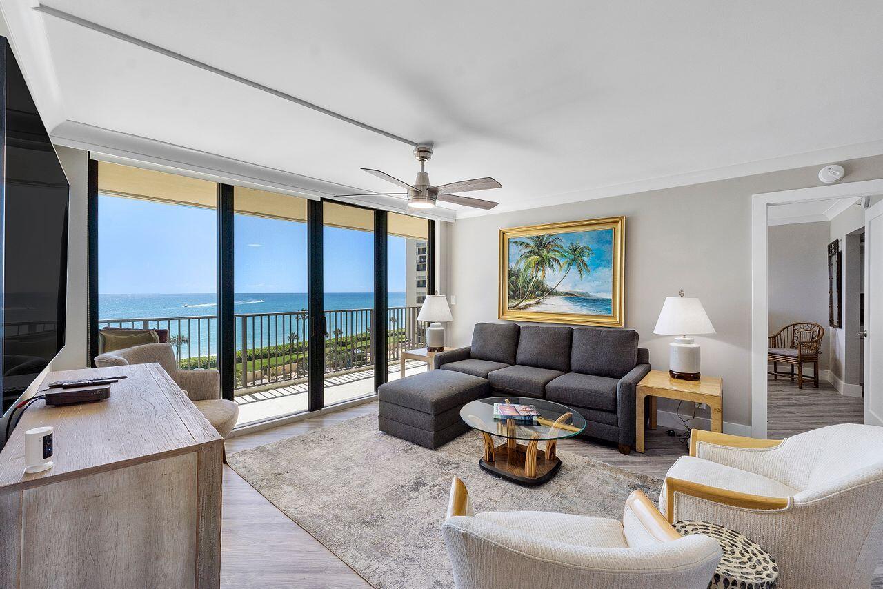 200 Ocean Trail Way, Unit 602 Jupiter, FL 33477 - Photo 4 of 50 a living room with furniture and a flat screen tv