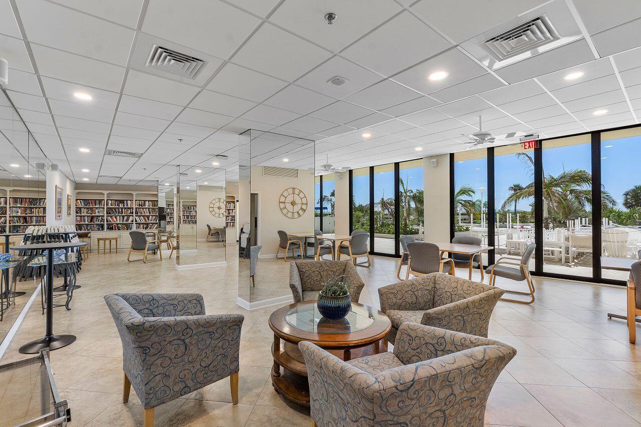 200 Ocean Trail Way, Unit 602 Jupiter, FL 33477 - Photo 42 of 50 a living room with furniture and a view of kitchen