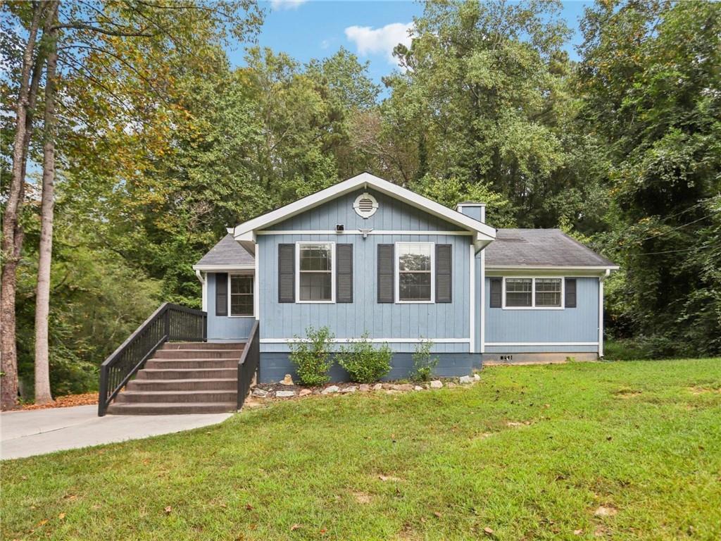 a front view of a house with a yard