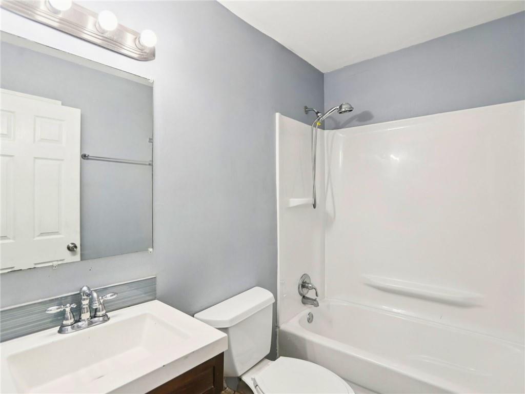 1918 West Kimberly Road Southwest Atlanta, GA 30331 - Photo 14 of 23 a bathroom with a sink toilet and shower