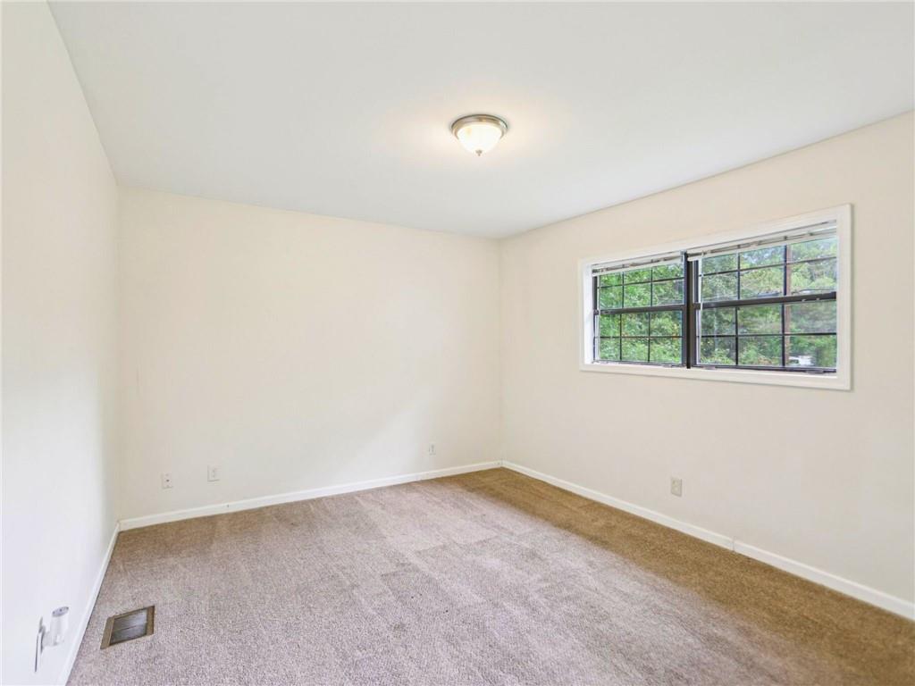 1918 West Kimberly Road Southwest Atlanta, GA 30331 - Photo 15 of 23 an empty room with a window