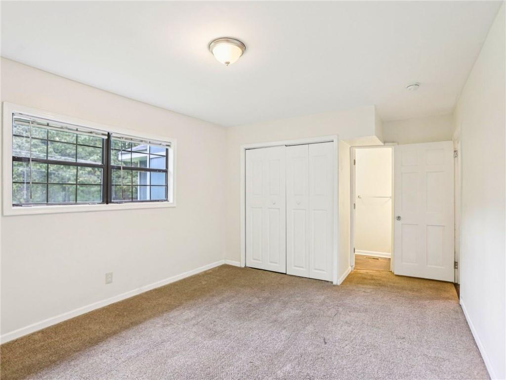 1918 West Kimberly Road Southwest Atlanta, GA 30331 - Photo 16 of 23 a view of an empty room with a window