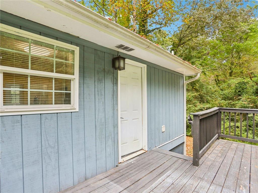 1918 West Kimberly Road Southwest Atlanta, GA 30331 - Photo 19 of 23 a view of house with deck and wooden floor