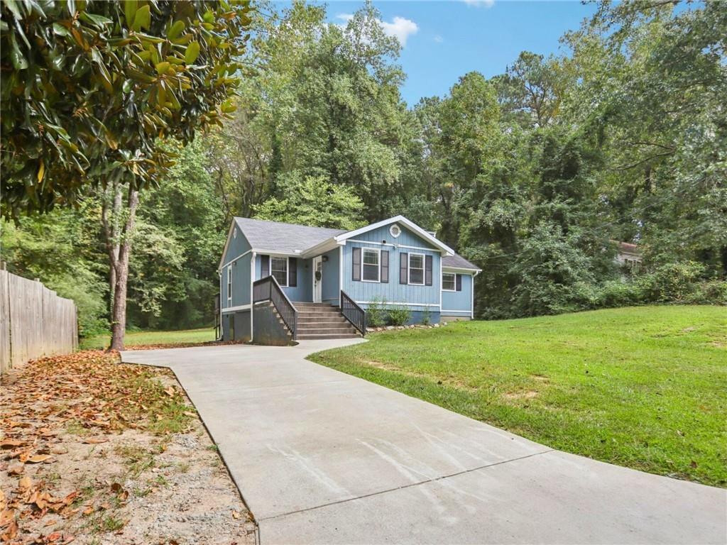1918 West Kimberly Road Southwest Atlanta, GA 30331 - Photo 2 of 23 a view of a house with a yard