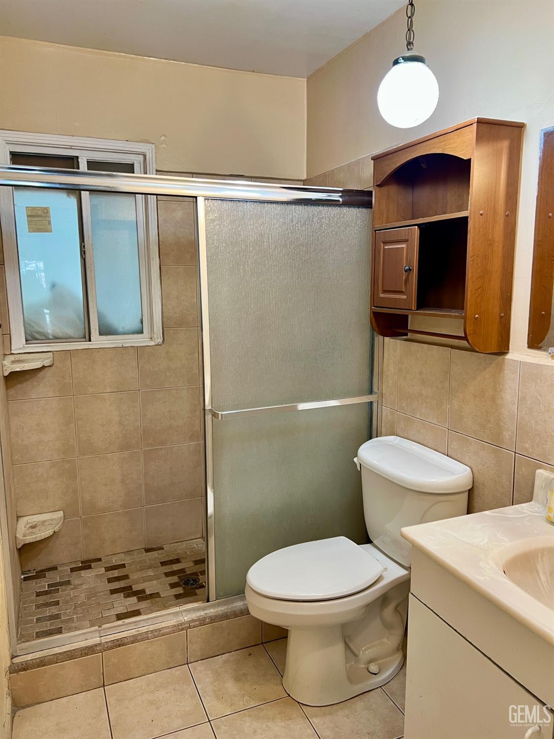 Undisclosed Address Wasco, CA 93280 - Photo 11 of 24 a bathroom with a toilet sink and shower