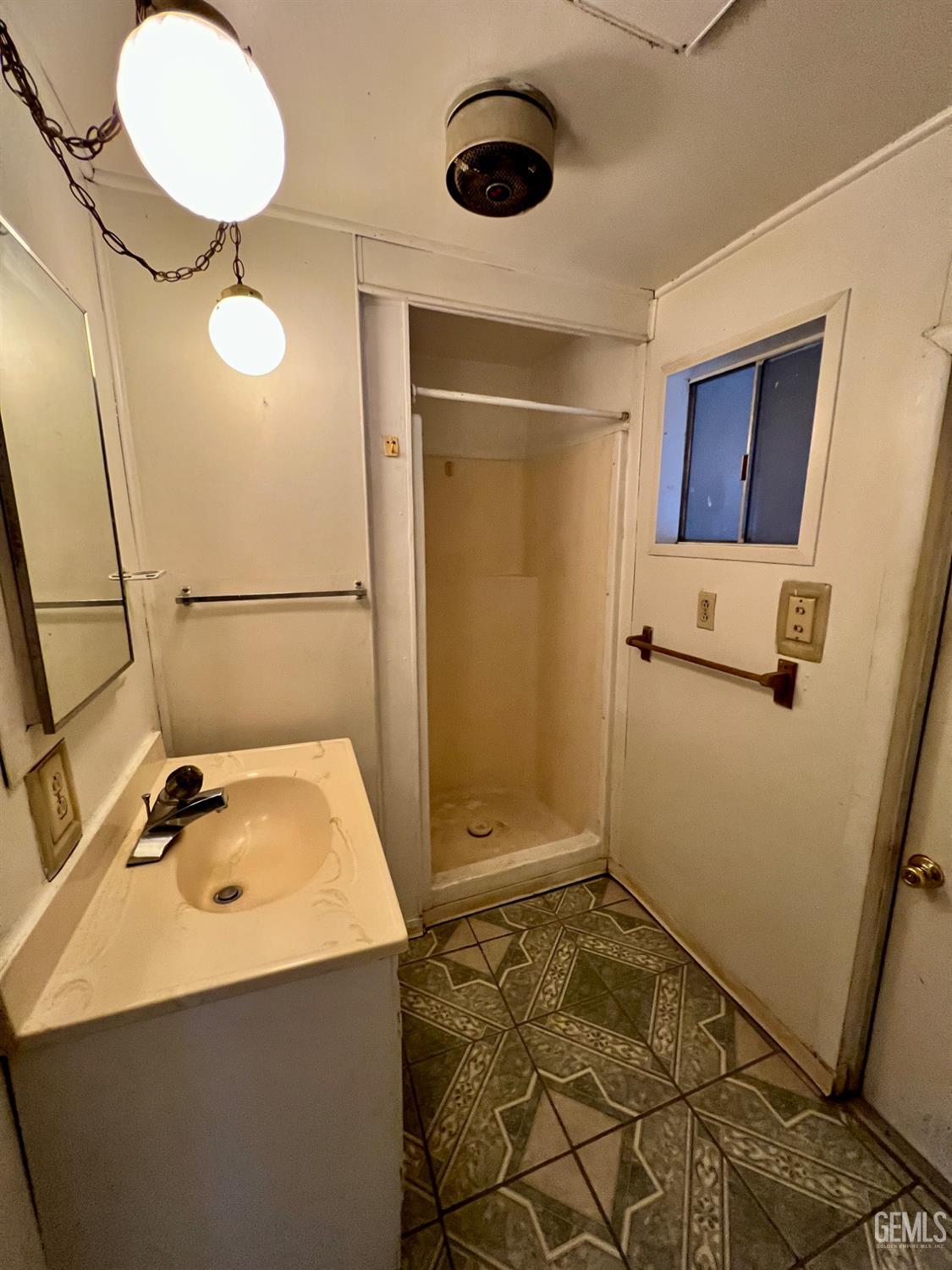 Undisclosed Address Wasco, CA 93280 - Photo 13 of 24 a bathroom with a sink and a mirror