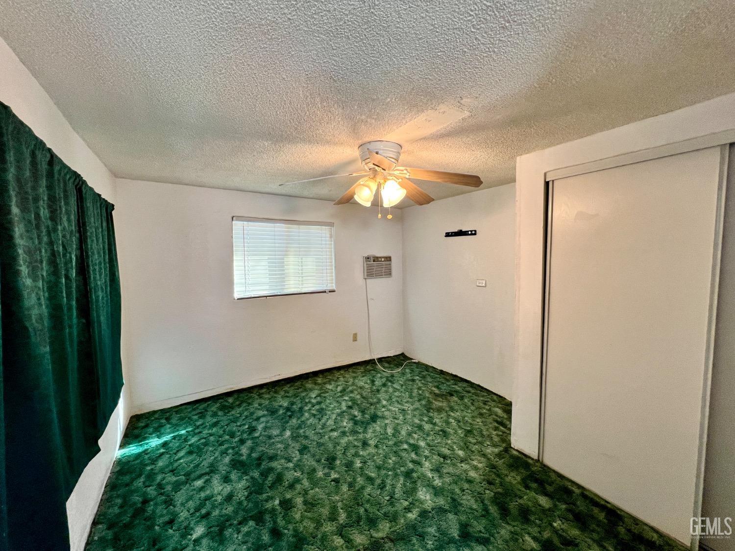 Undisclosed Address Wasco, CA 93280 - Photo 17 of 24 wooden floor in an empty room with a window
