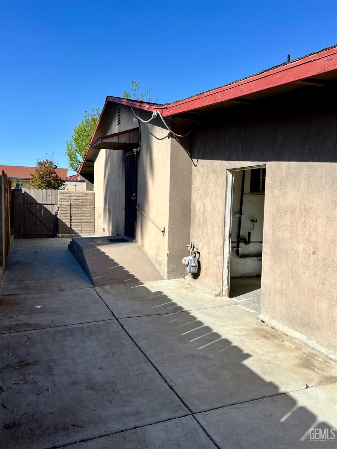 Undisclosed Address Wasco, CA 93280 - Photo 19 of 24 a view of a house with a outdoor space