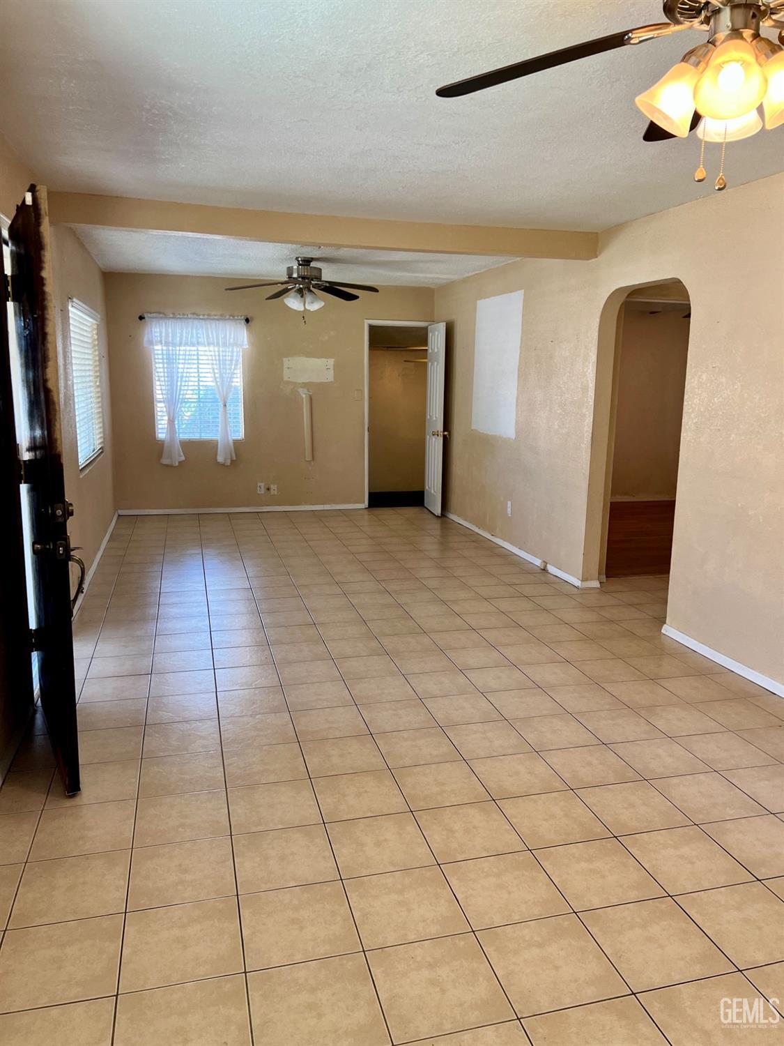 Undisclosed Address Wasco, CA 93280 - Photo 4 of 24 a view of entryway with a window and a chandelier