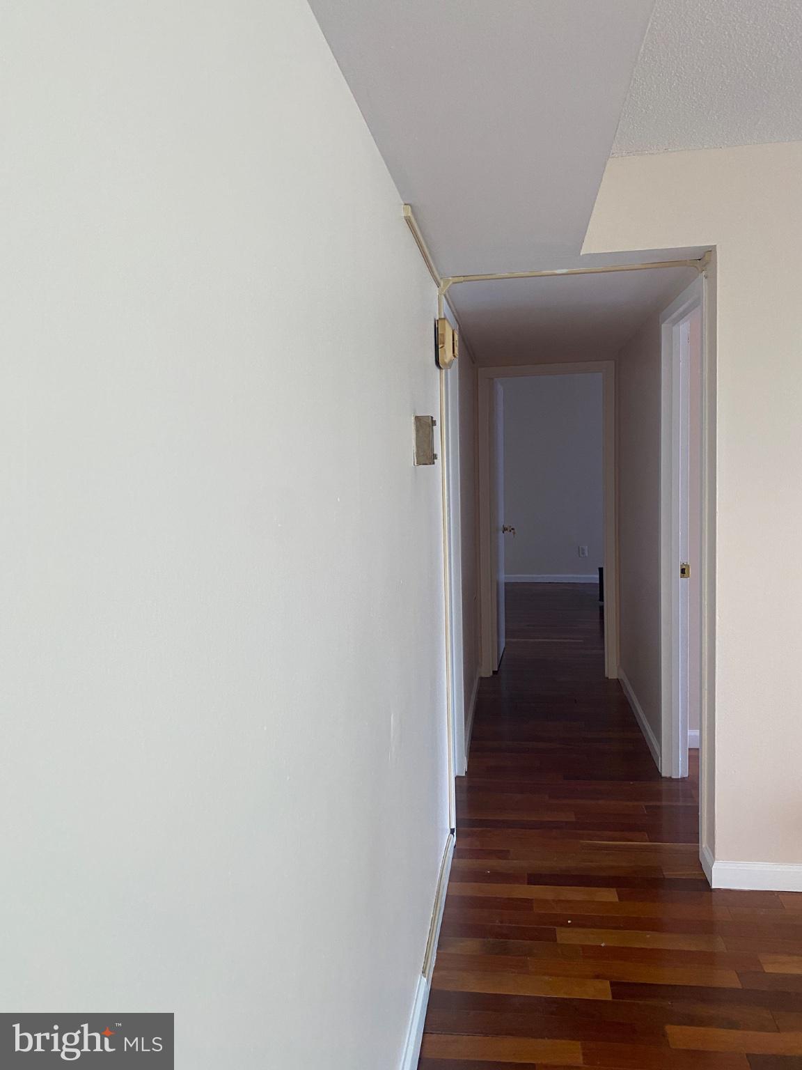 1836 Metzerott Road, Unit 707 Hyattsville, MD 20783 - Photo 5 of 13 Inviting hallway with warm wood floors.