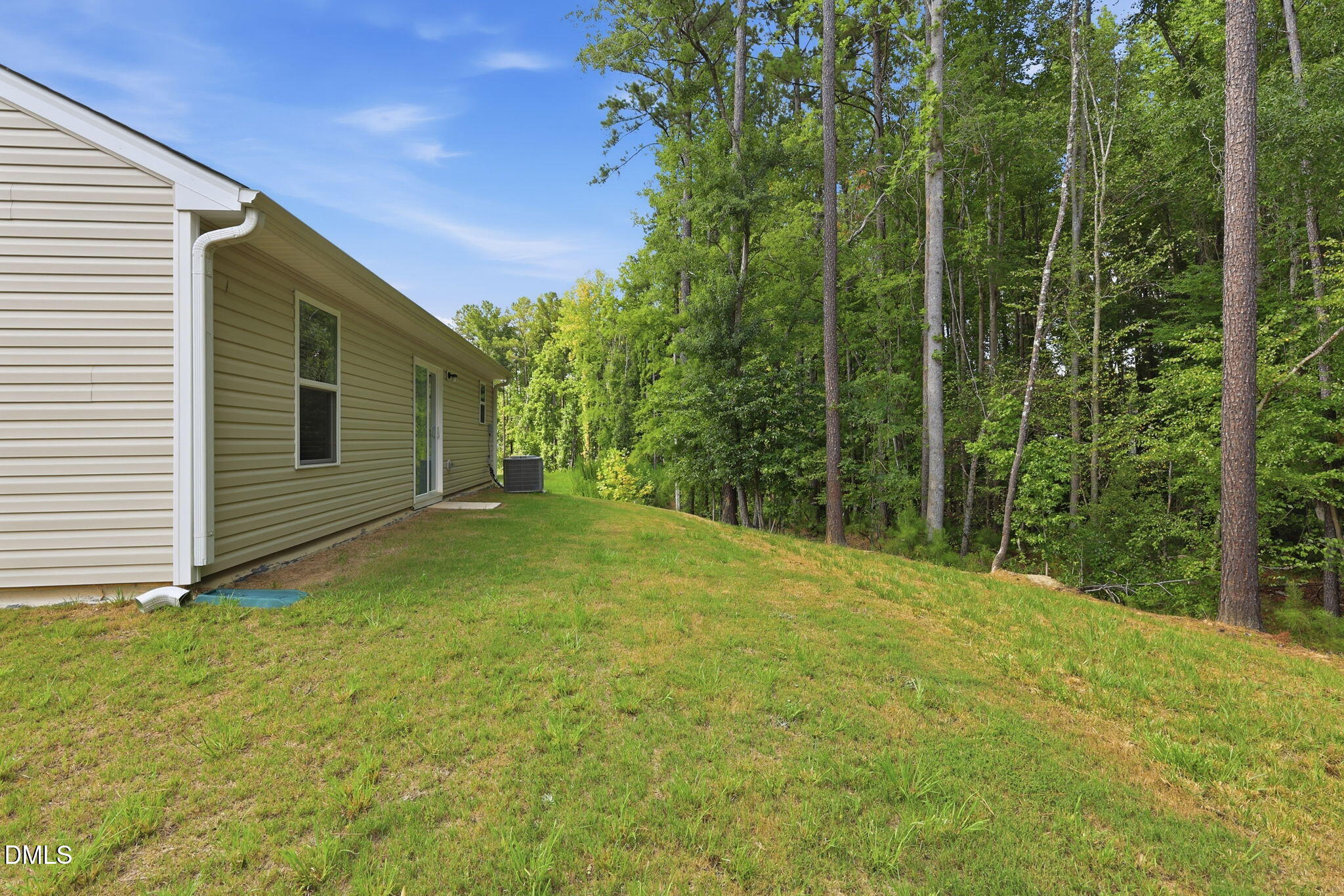 90 Everglade Way Angier, NC 27501 - Photo 31 of 36 a backyard of a house with lots of green space