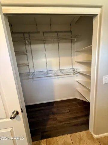 a view of an entryway with wooden floor