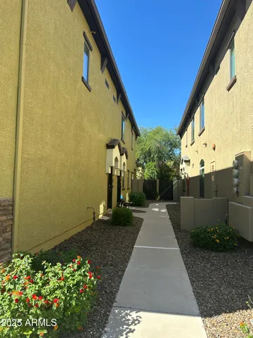 a view of multiple houses with a street