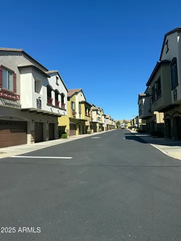 a view of a park that has a tree on the side of it