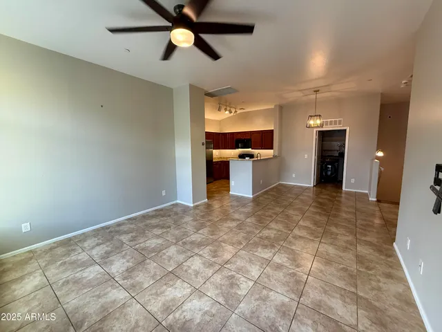 a view of a kitchen with a sink and a stove top oven