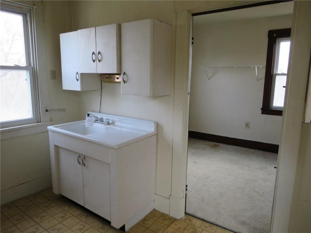 407 Linnview Avenue Pittsburgh, PA 15210 - Photo 15 of 38 a bathroom with a sink and a mirror