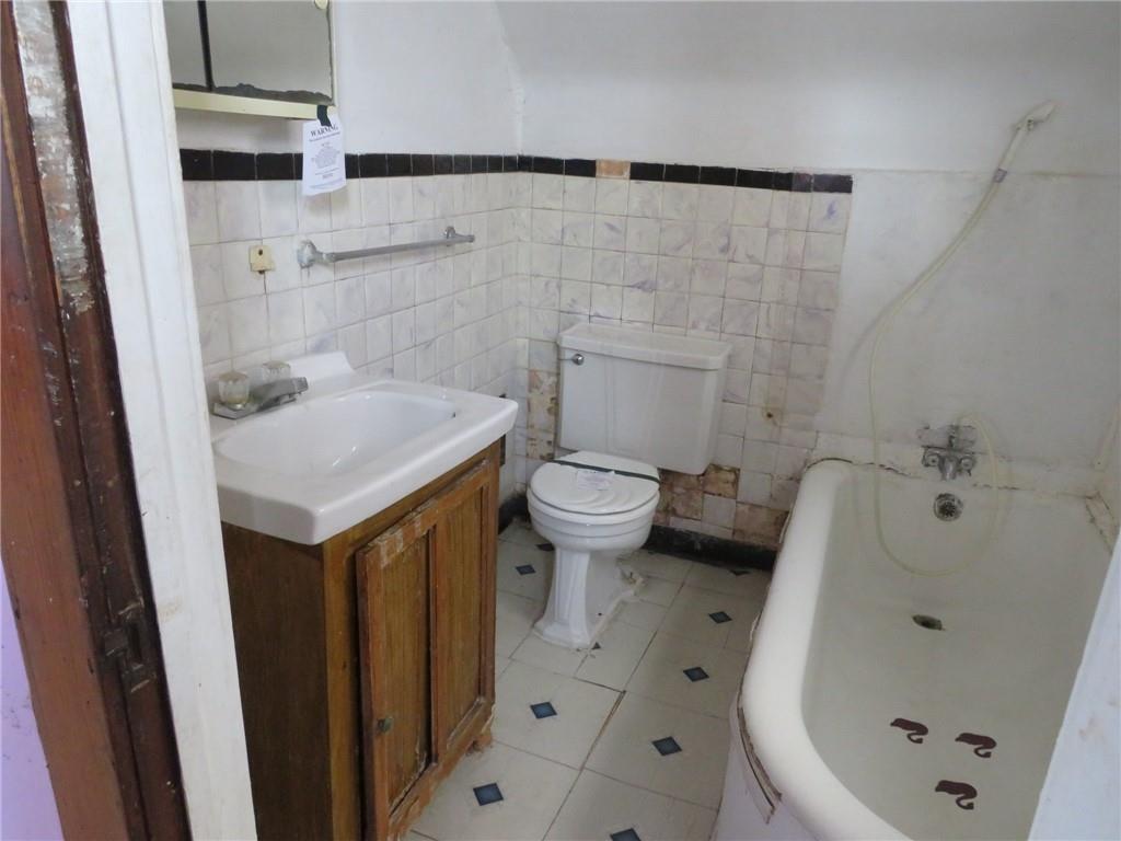 407 Linnview Avenue Pittsburgh, PA 15210 - Photo 24 of 38 a bathroom with a sink and a toilet