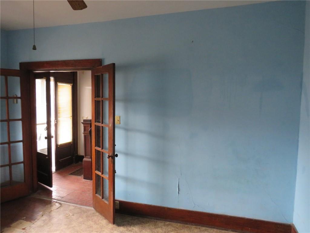 407 Linnview Avenue Pittsburgh, PA 15210 - Photo 36 of 38 a view of a livingroom with wooden floor and windows