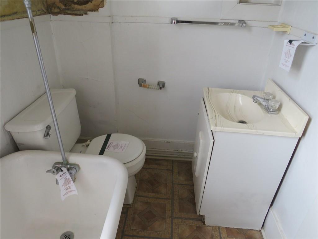 407 Linnview Avenue Pittsburgh, PA 15210 - Photo 6 of 38 a bathroom with a sink and toilet