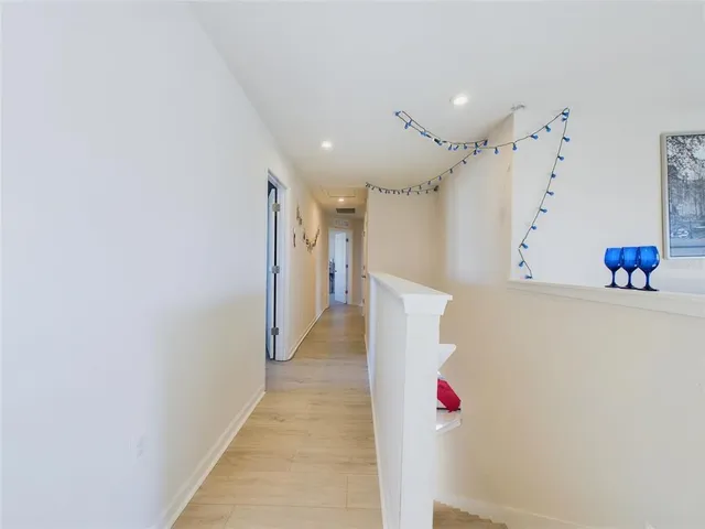 a house view with swimming pool in front of it