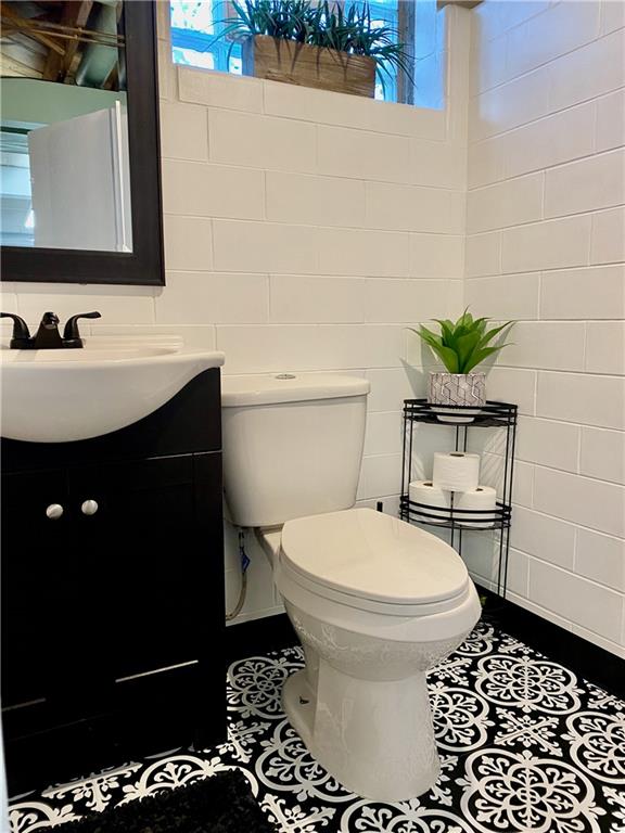 2399 Ridge Road Monaca, PA 15061 - Photo 16 of 20 a bathroom with a sink toilet and shower