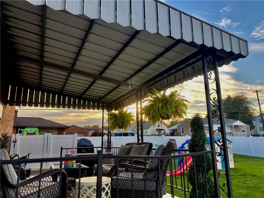 2399 Ridge Road Monaca, PA 15061 - Photo 19 of 20 a view of a patio with table and chairs potted plants with floor to ceiling window