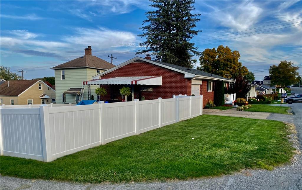 2399 Ridge Road Monaca, PA 15061 - Photo 2 of 20 a front view of a house with a yard