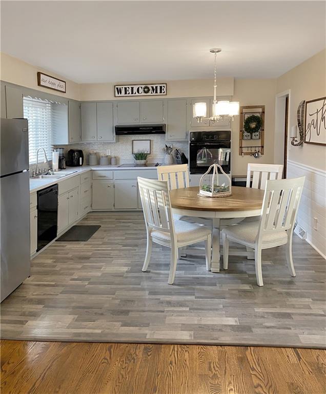 2399 Ridge Road Monaca, PA 15061 - Photo 5 of 20 a large kitchen with a table and chairs