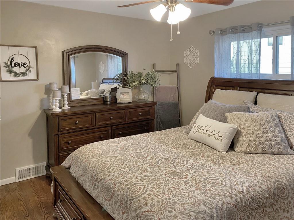 2399 Ridge Road Monaca, PA 15061 - Photo 8 of 20 a bedroom with a bed and a dresser