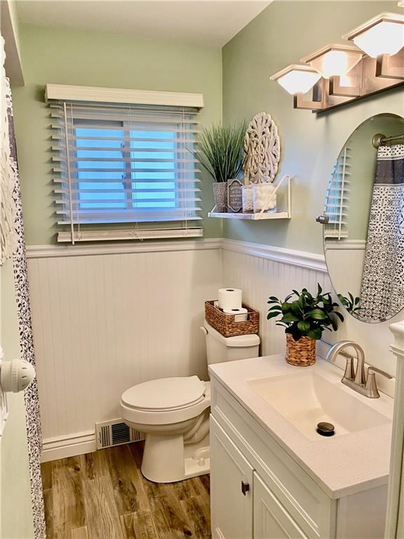 2399 Ridge Road Monaca, PA 15061 - Photo 10 of 20 a bathroom with a sink a toilet and mirror