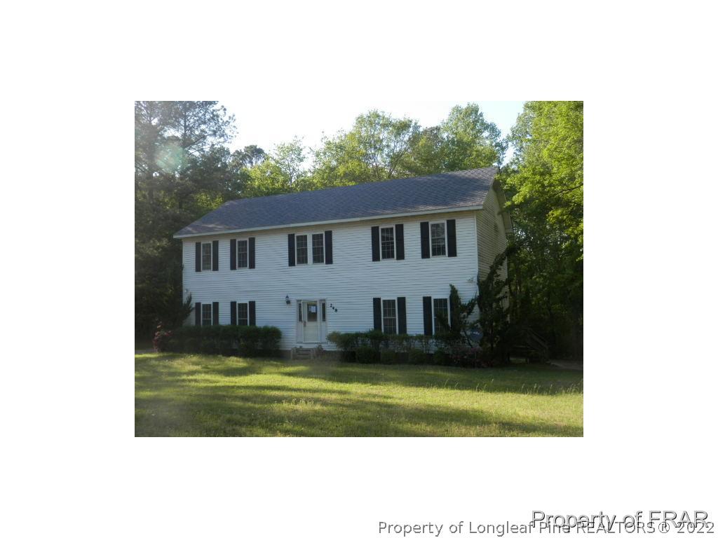 248 St Matthews Church Road Raeford, NC 28376 - Photo 1 of 14 a view of a house with a yard