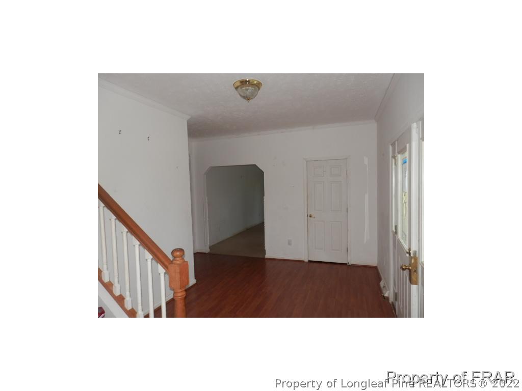 248 St Matthews Church Road Raeford, NC 28376 - Photo 2 of 14 a view of a hallway with stairs