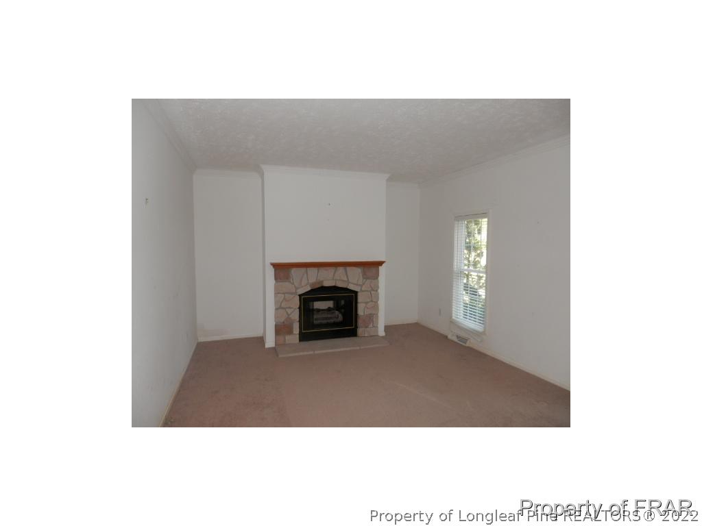 248 St Matthews Church Road Raeford, NC 28376 - Photo 3 of 14 a view of an empty room with a window