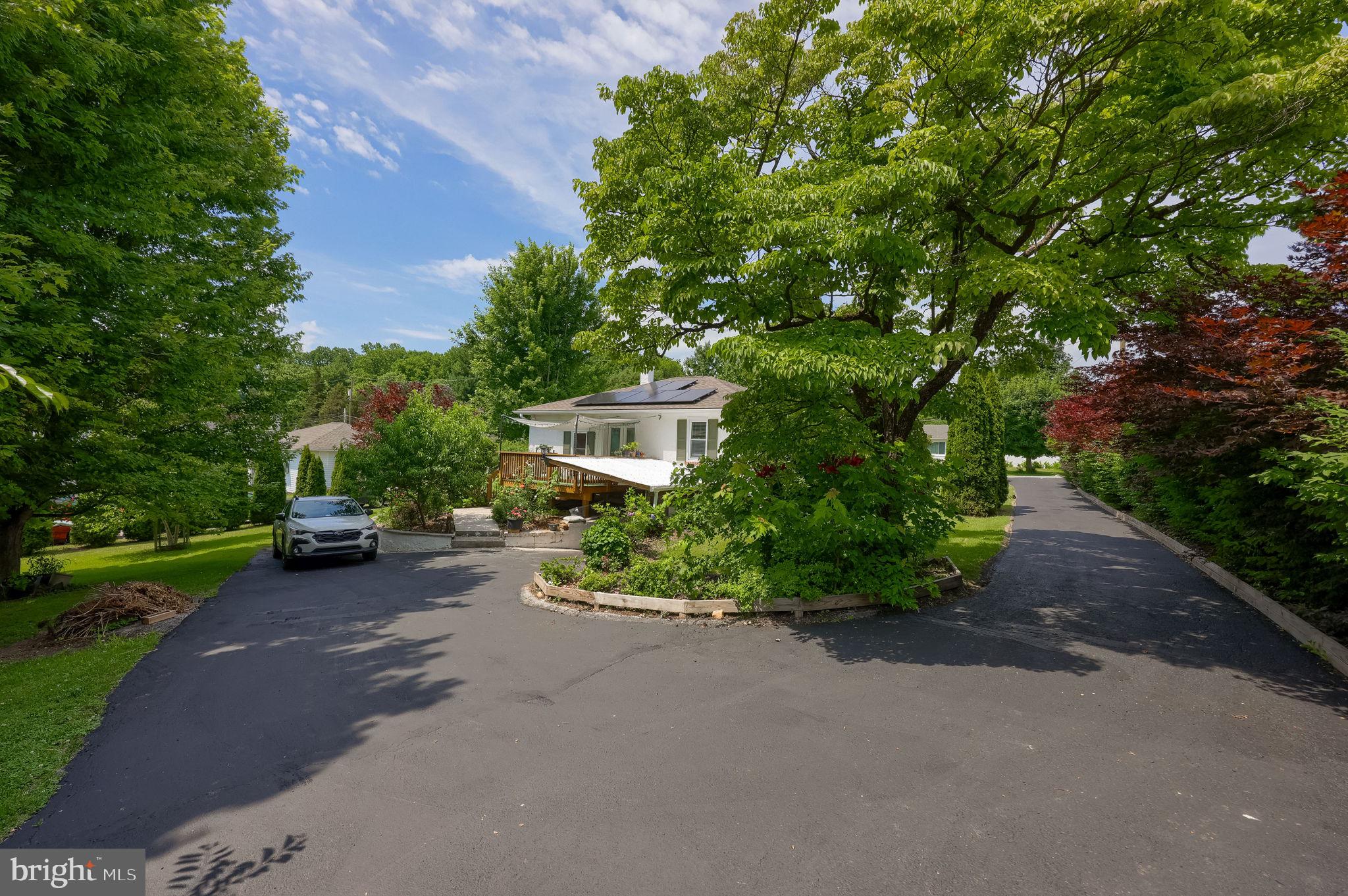 355 Harry Road Coatesville, PA 19320 - Photo 13 of 48 Charming home nestled among lush greenery.