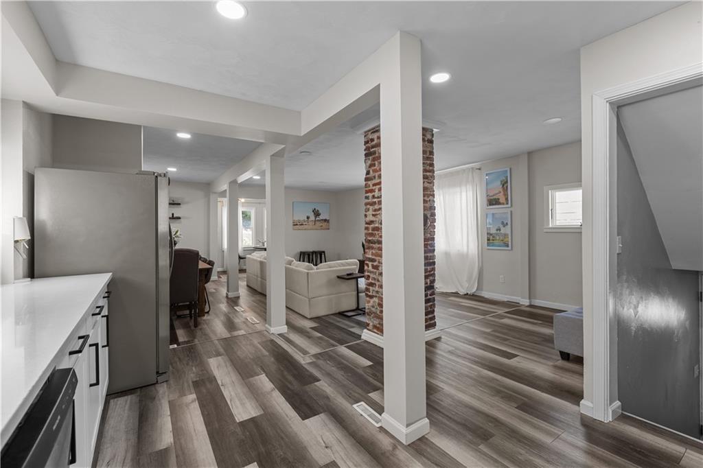 5575 Aiken Road McKees Rocks, PA 15136 - Photo 12 of 33 a view of a hallway with wooden floor windows and a livingroom