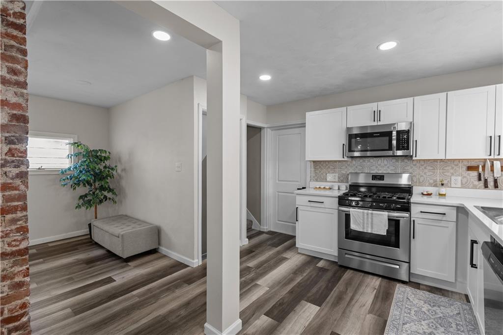 5575 Aiken Road McKees Rocks, PA 15136 - Photo 13 of 33 a kitchen with a sink and a stove top oven