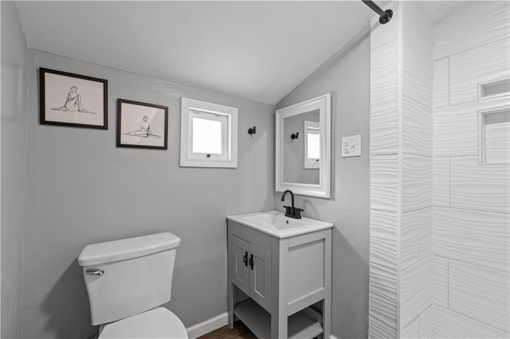 5575 Aiken Road McKees Rocks, PA 15136 - Photo 22 of 33 a bathroom with a toilet sink and mirror