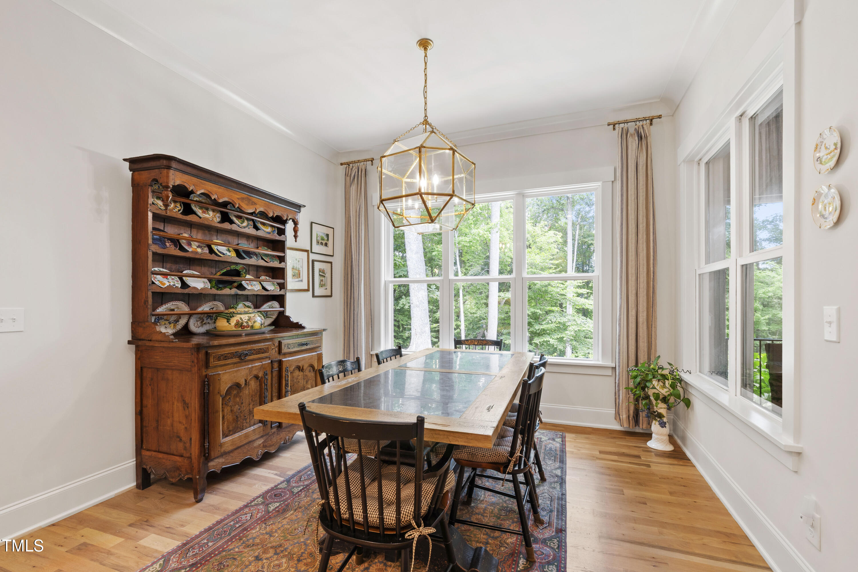 541 Sunset Grove Drive Pittsboro, NC 27312 - Photo 17 of 75 a dining room with furniture window wooden floor