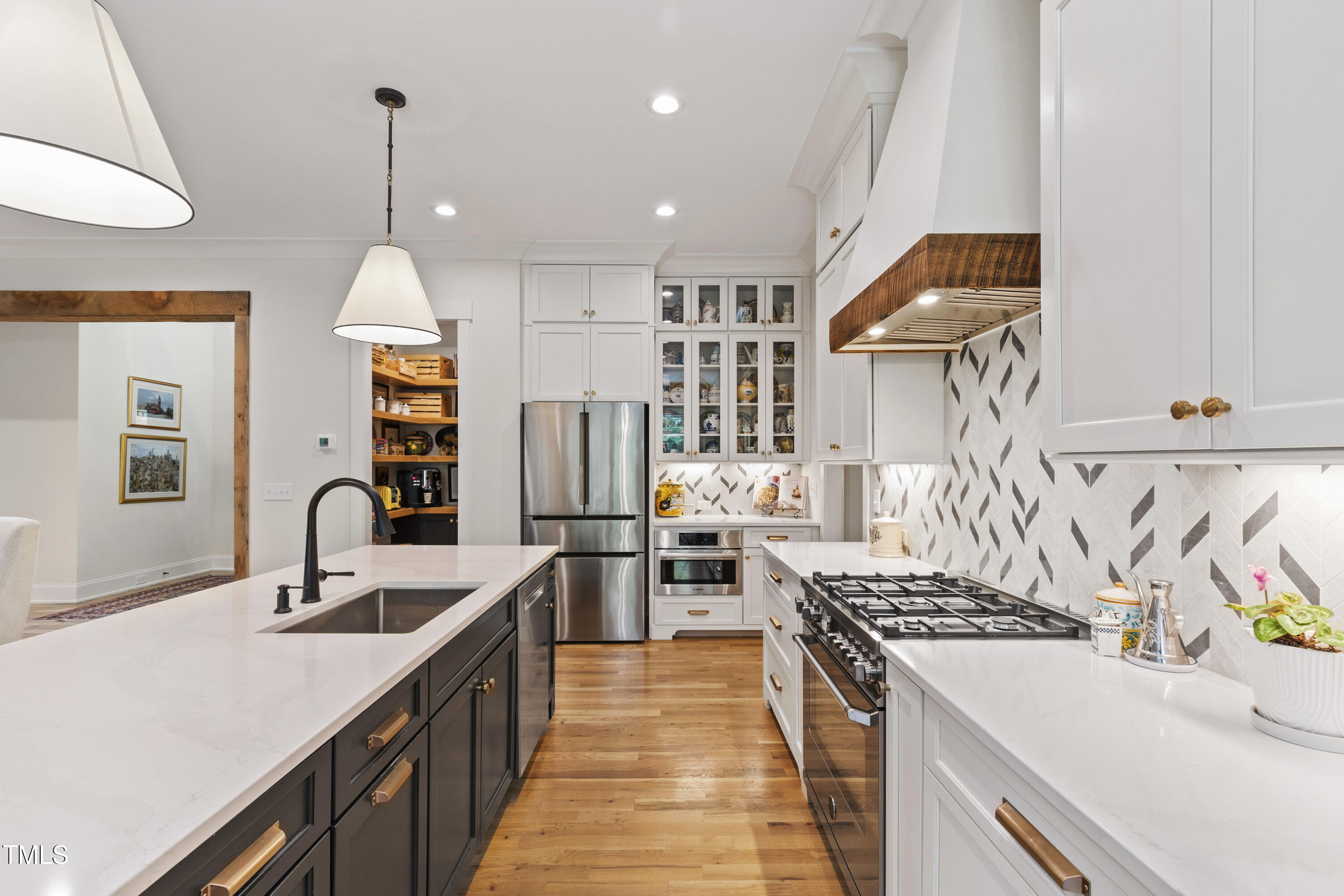 541 Sunset Grove Drive Pittsboro, NC 27312 - Photo 20 of 75 a kitchen with sink a stove and cabinets