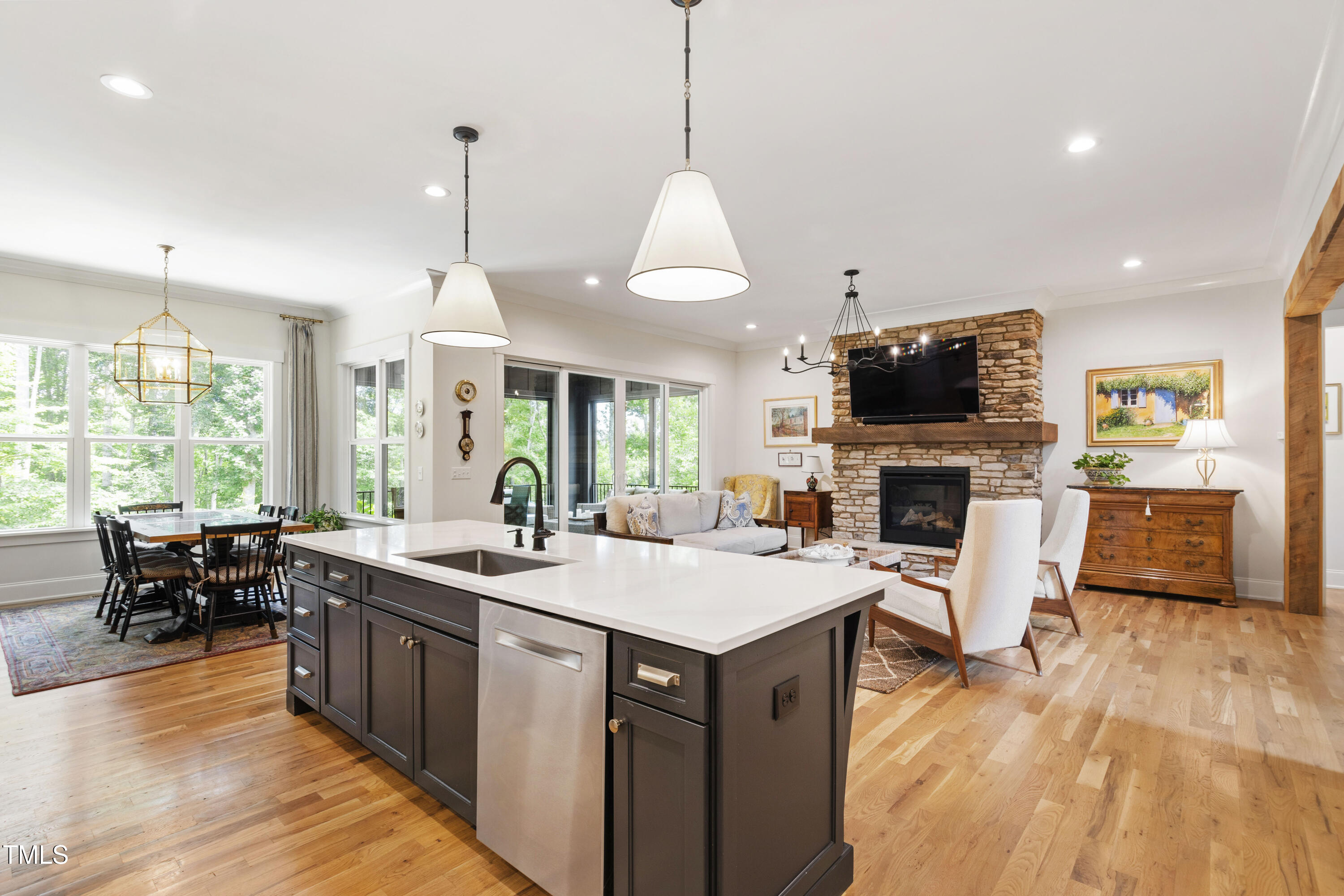541 Sunset Grove Drive Pittsboro, NC 27312 - Photo 21 of 75 a large kitchen with kitchen island a sink counter space appliances and a large window