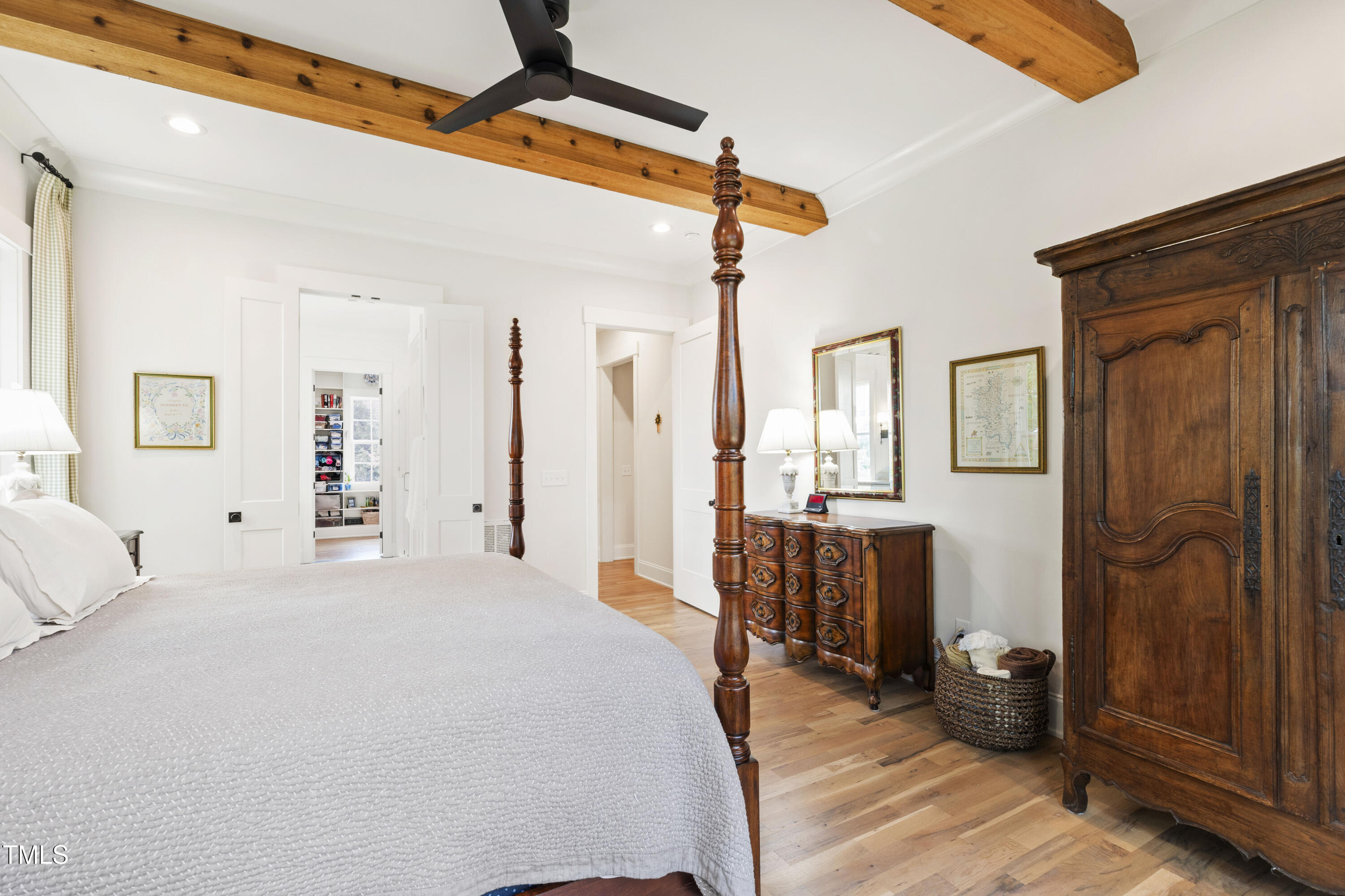 541 Sunset Grove Drive Pittsboro, NC 27312 - Photo 26 of 75 a bedroom with a bed and wooden floor