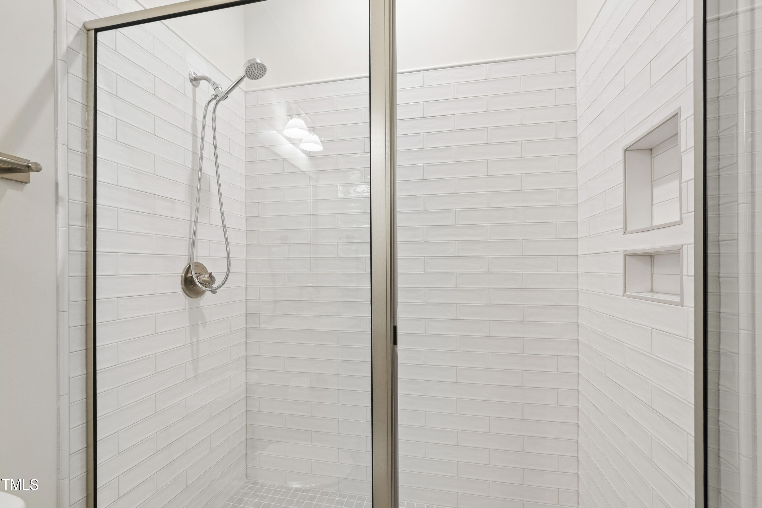 541 Sunset Grove Drive Pittsboro, NC 27312 - Photo 35 of 75 a bathroom with a glass shower door
