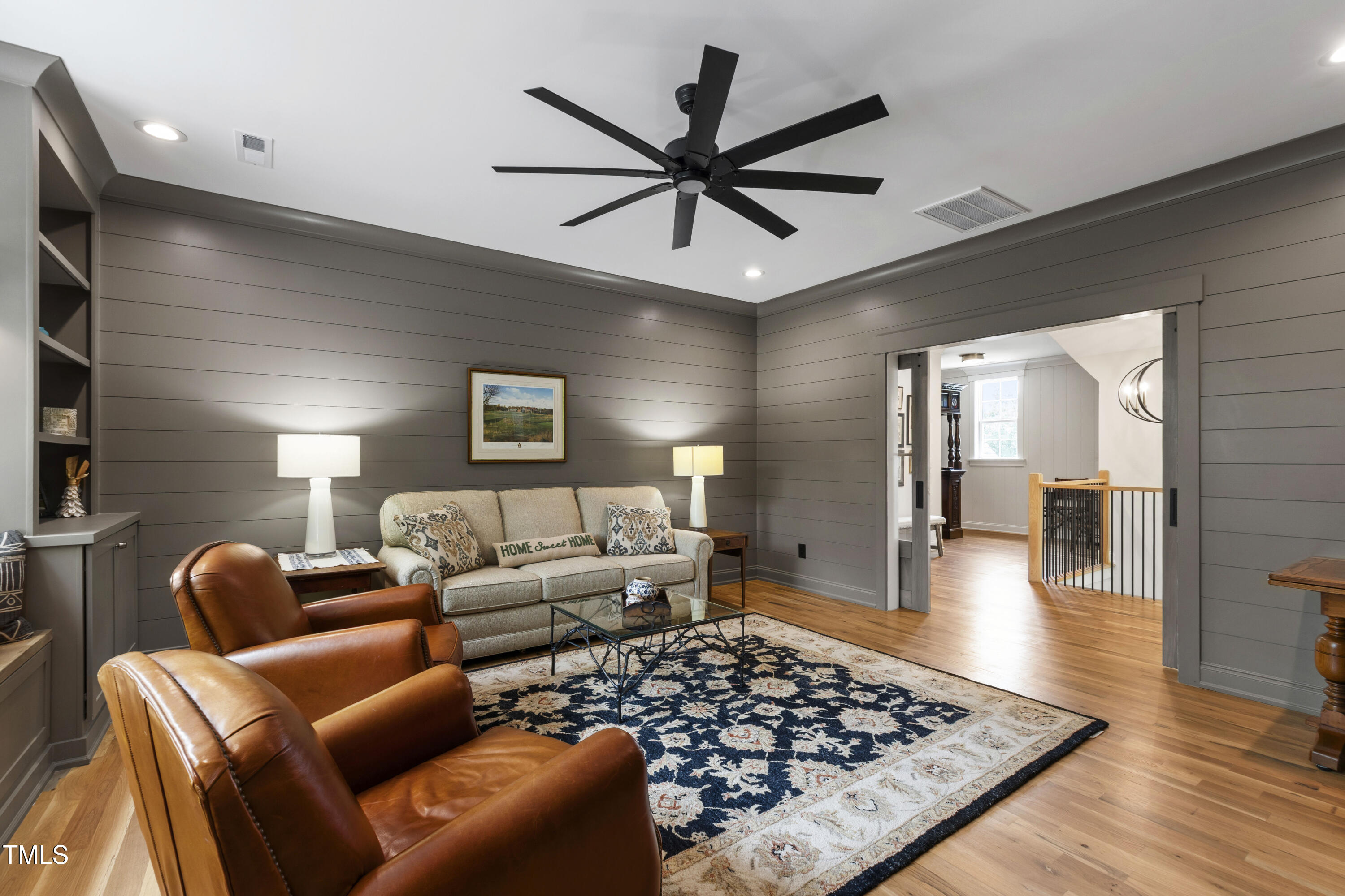 541 Sunset Grove Drive Pittsboro, NC 27312 - Photo 42 of 75 a living room with furniture a rug and a ceiling fan