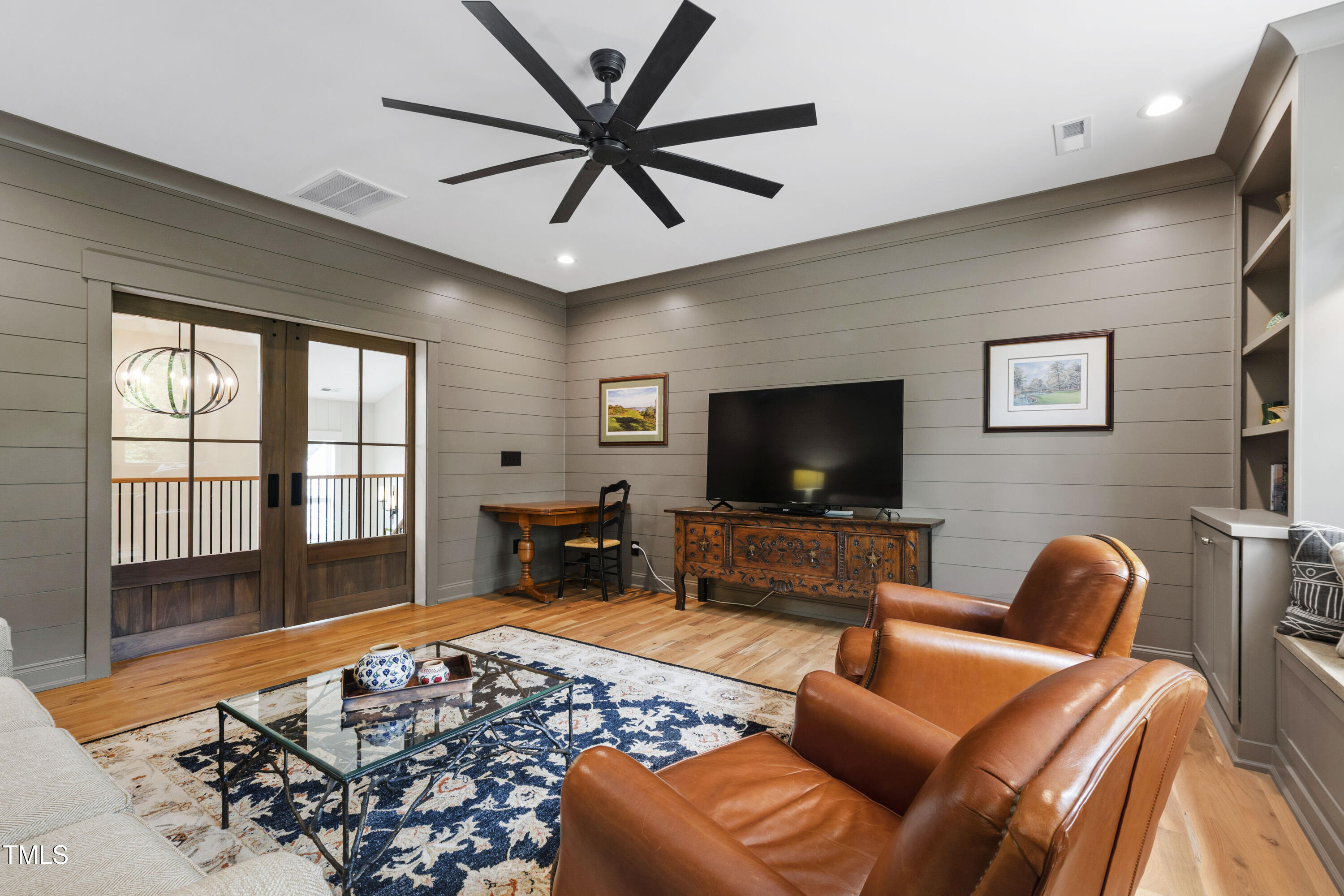 541 Sunset Grove Drive Pittsboro, NC 27312 - Photo 44 of 75 a living room with furniture a flat screen tv and a large window