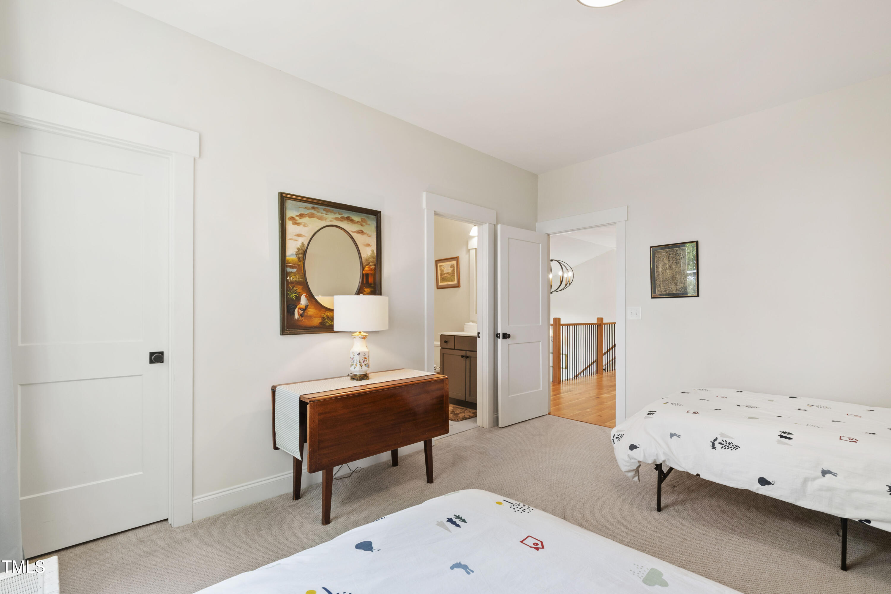 541 Sunset Grove Drive Pittsboro, NC 27312 - Photo 47 of 75 a bedroom with a bed and wooden floor